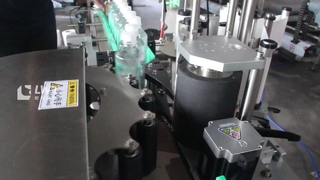 Etiquetadora de botellas redondas con posicionamiento de rueda de estrella
